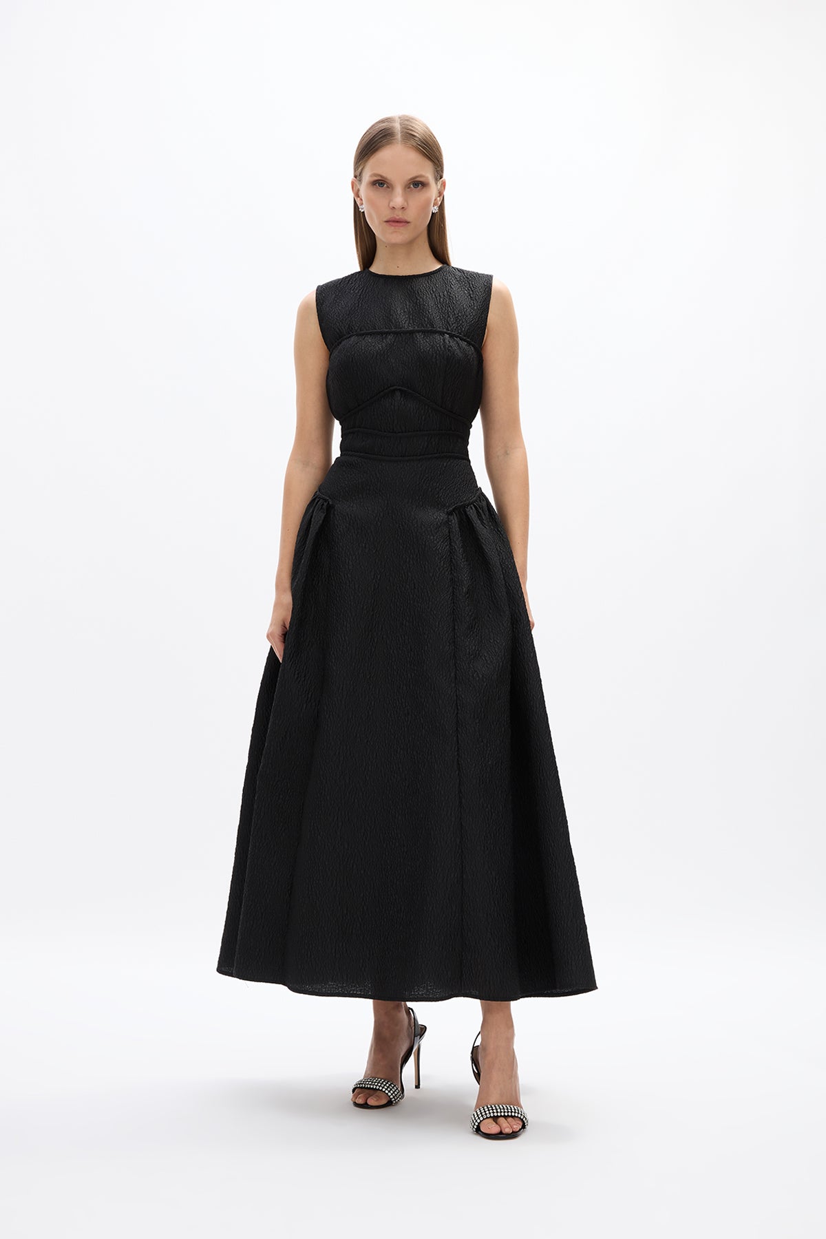 Sophia Dress: sophisticated black cocktail dress featuring fitted waist and voluminous skirt, perfect for day to night soirees. 