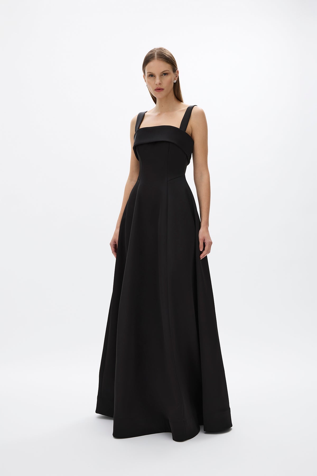 Sera Gown: extravagant black formal gown featuring square neckline and voluminous flowing skirt, perfect for evening events.