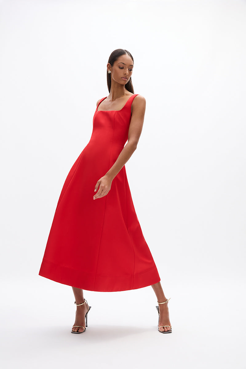 Sera Dress: elegant red cocktail dress featuring square neckline and flowing skirt, perfect for evening events.