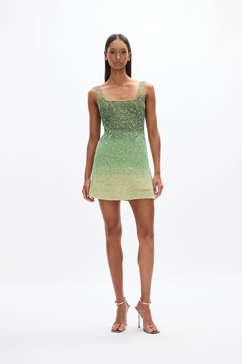 Kaito Mini: stylish green mini dress with wide straps, square neckline, and hand-placed embellishment, perfect for special events. 