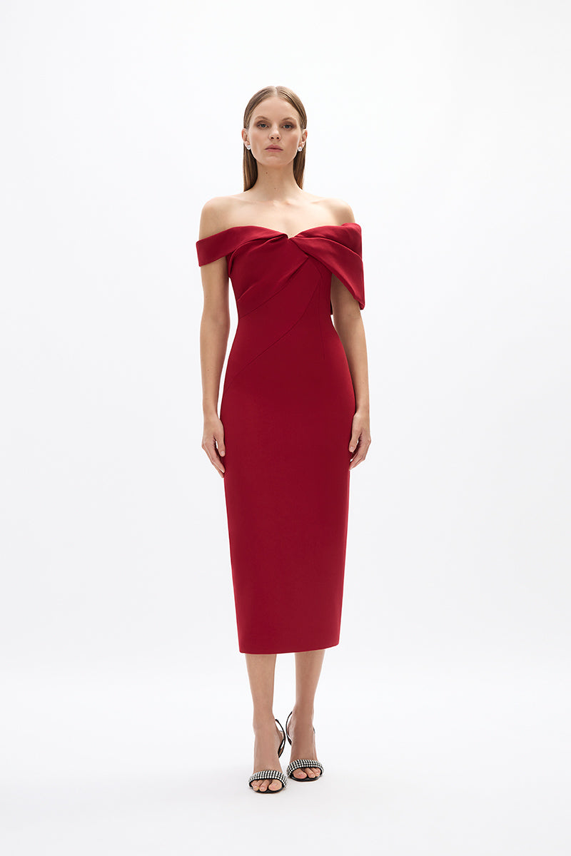 Mattie Dress: elegant red cocktail dress featuring off-the-shoulder detail and back split falling to a mid-length.