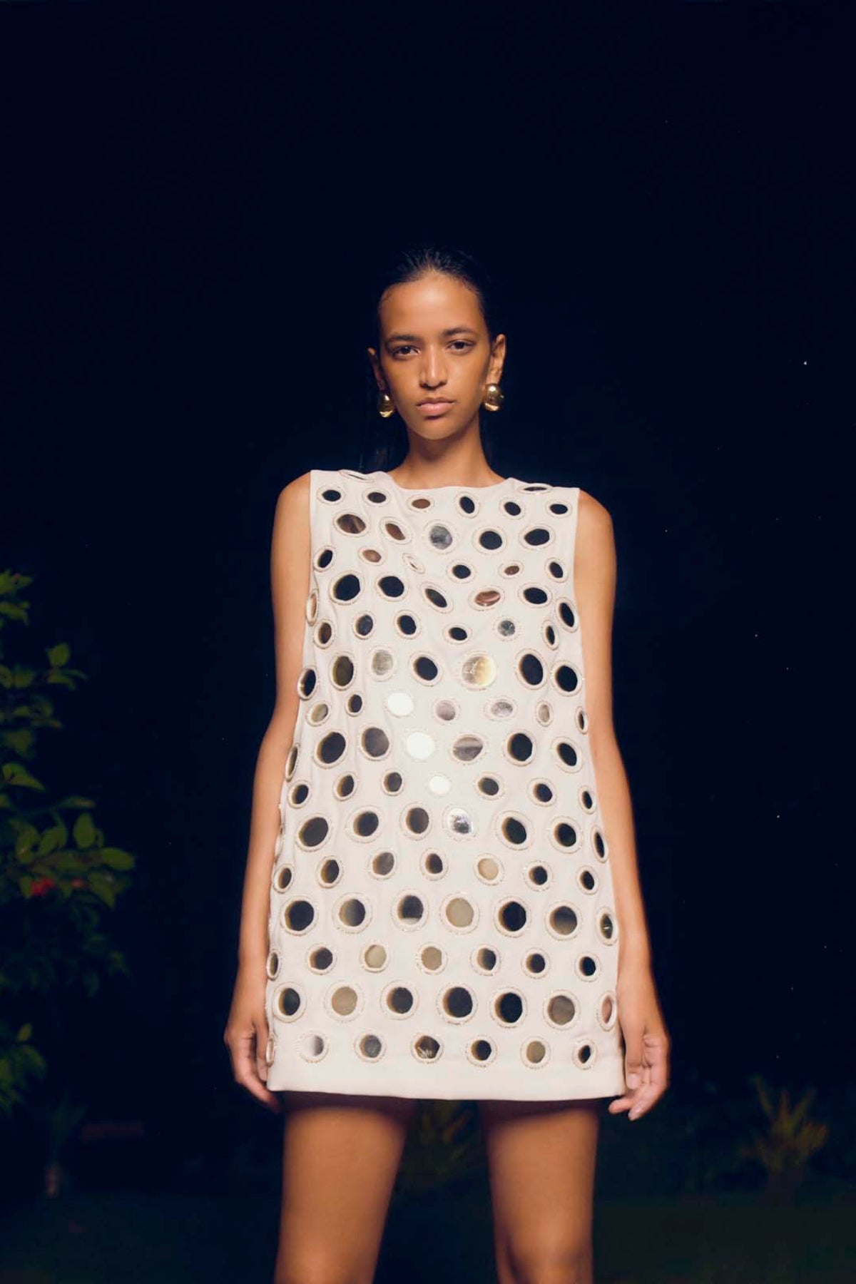 Beck Mini: chic white dress featuring round mirror embellishments and scoop neck falling to a mini-length.