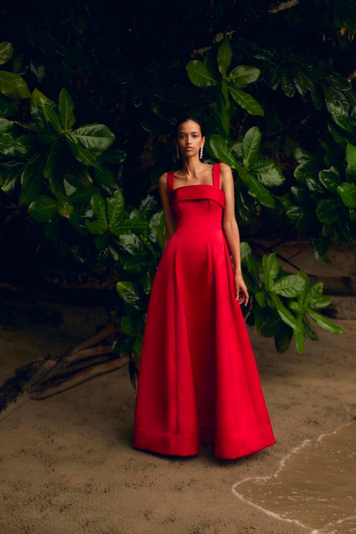 Sera Gown: extravagant red formal gown featuring square neckline and voluminous flowing skirt, perfect for evening events.