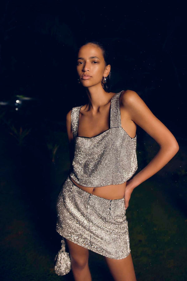 Thora Skirt: silver glow mesh mini skirt, perfect for day to night events. 