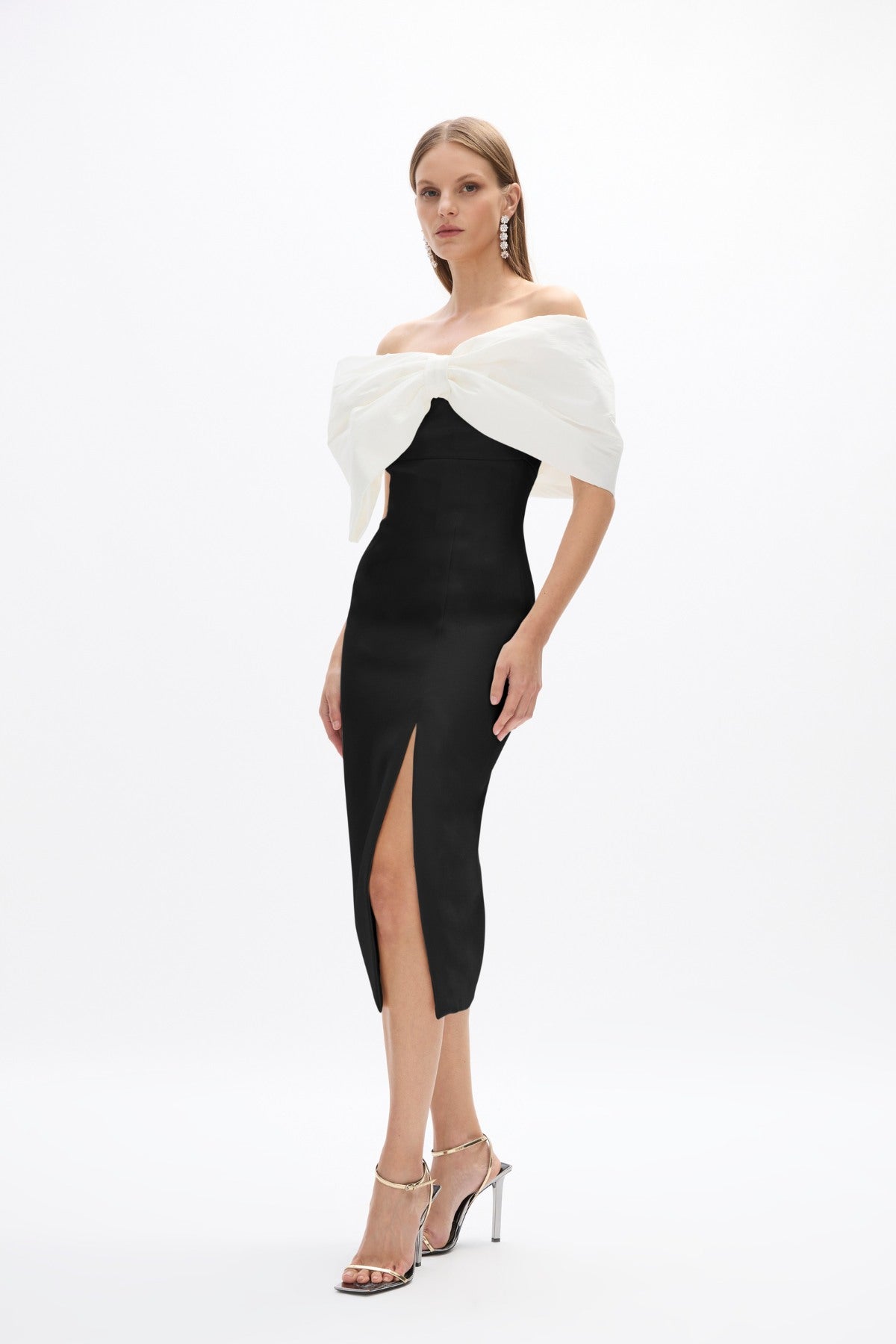 Kace Dress: sophisticated black and white cocktail dress featuring off-the-shoulder bow detail and side split. 