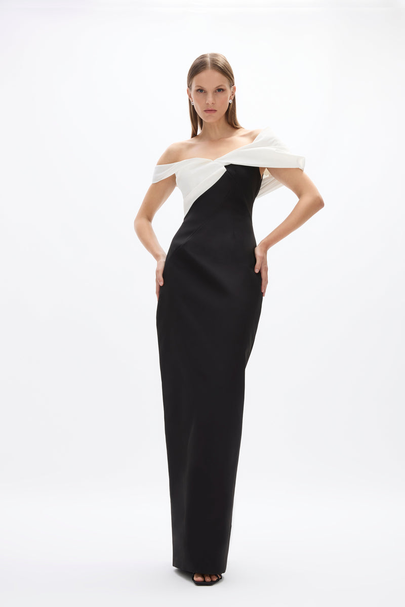 Delila Gown: sophisticated black and white gown with fitted bodice and off-the-shoulder detail, perfect for evening events. 