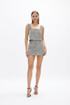 Thora Skirt: silver glow mesh mini skirt, perfect for day to night events. 